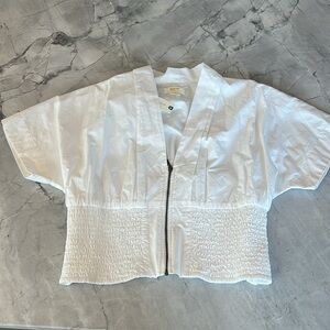 White short sleeve top with tags.